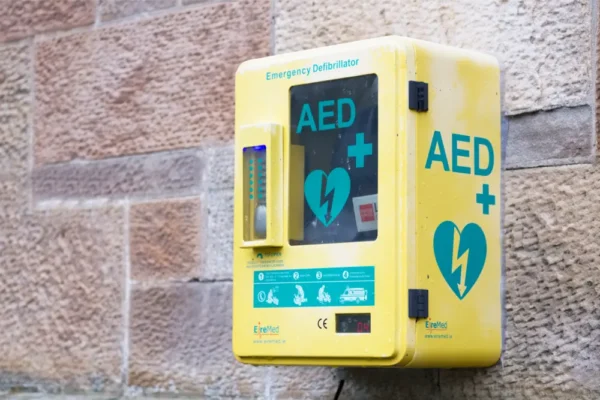 a yellow AED on a wall for a BLS & Safe Use of an AED course